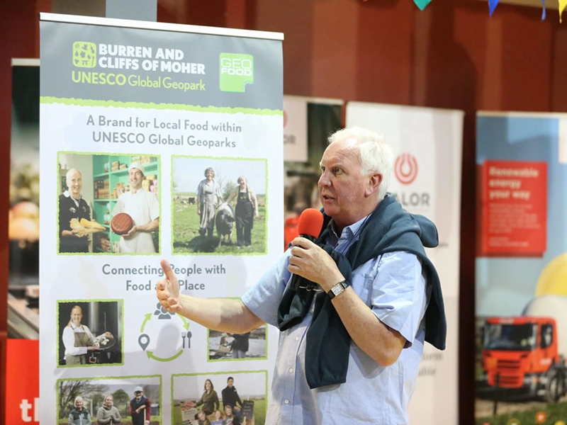 John McKenna of McKenna's Guides in front of my GEOfood banner John McKenna of McKenna's Guides in front of my GEOfood banner